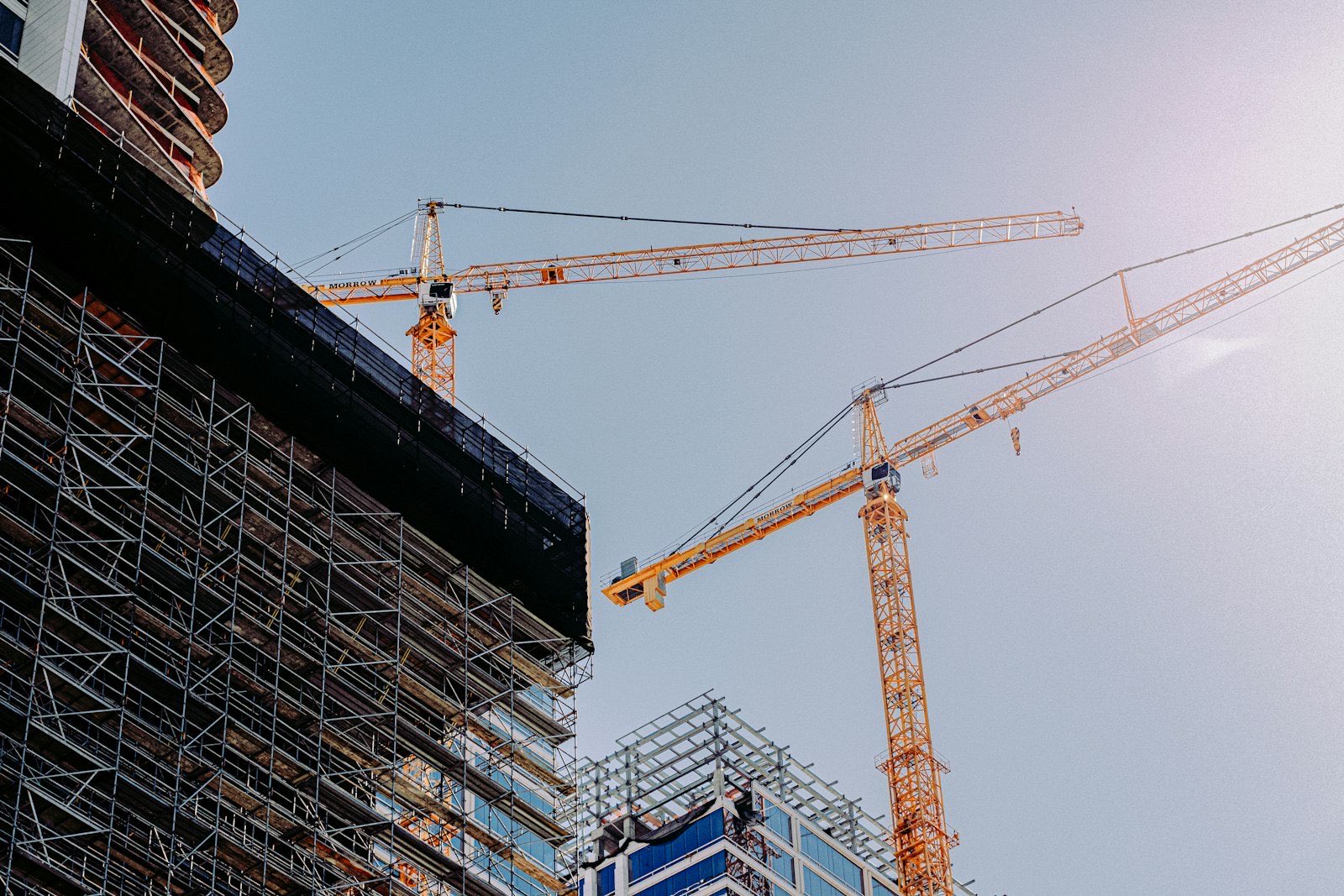 Tower cranes over a high-rise steel-frame construction site